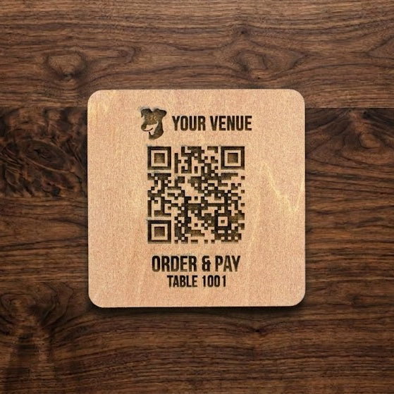Wooden tile with QR code and text engraved wooden surface